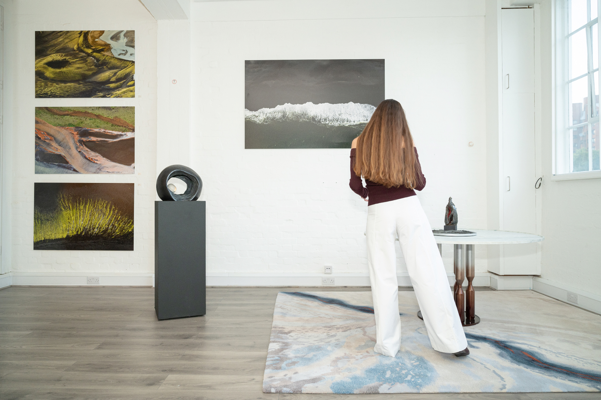 Agape Space gallery interior with artworks and sculpture